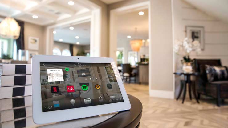 Family using Control4 in living room